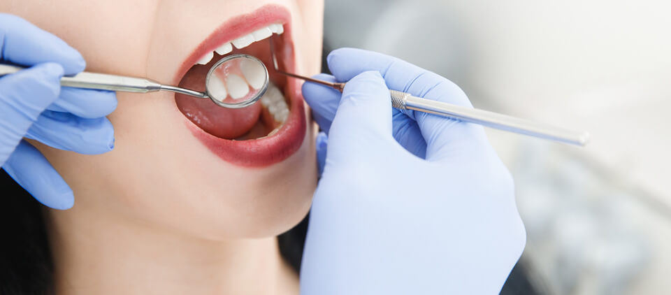 woman-receiving-dental-cleaning